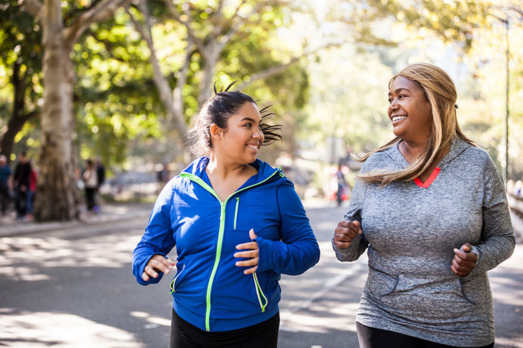 Photo of two women jogging.