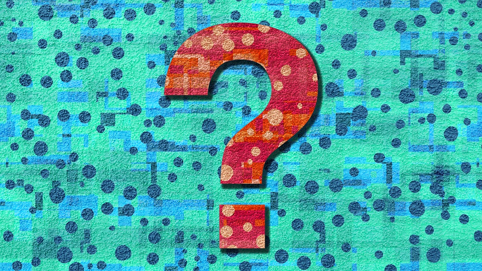 A Red Question Stylized Question Mark on a Blue polka dot background