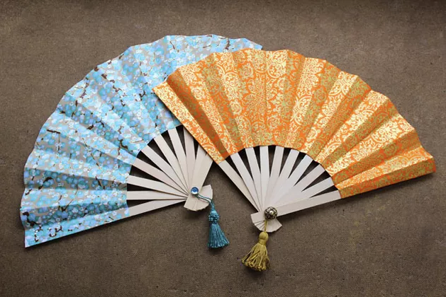 Japanese Fan craft. One blue and one orange and gold 