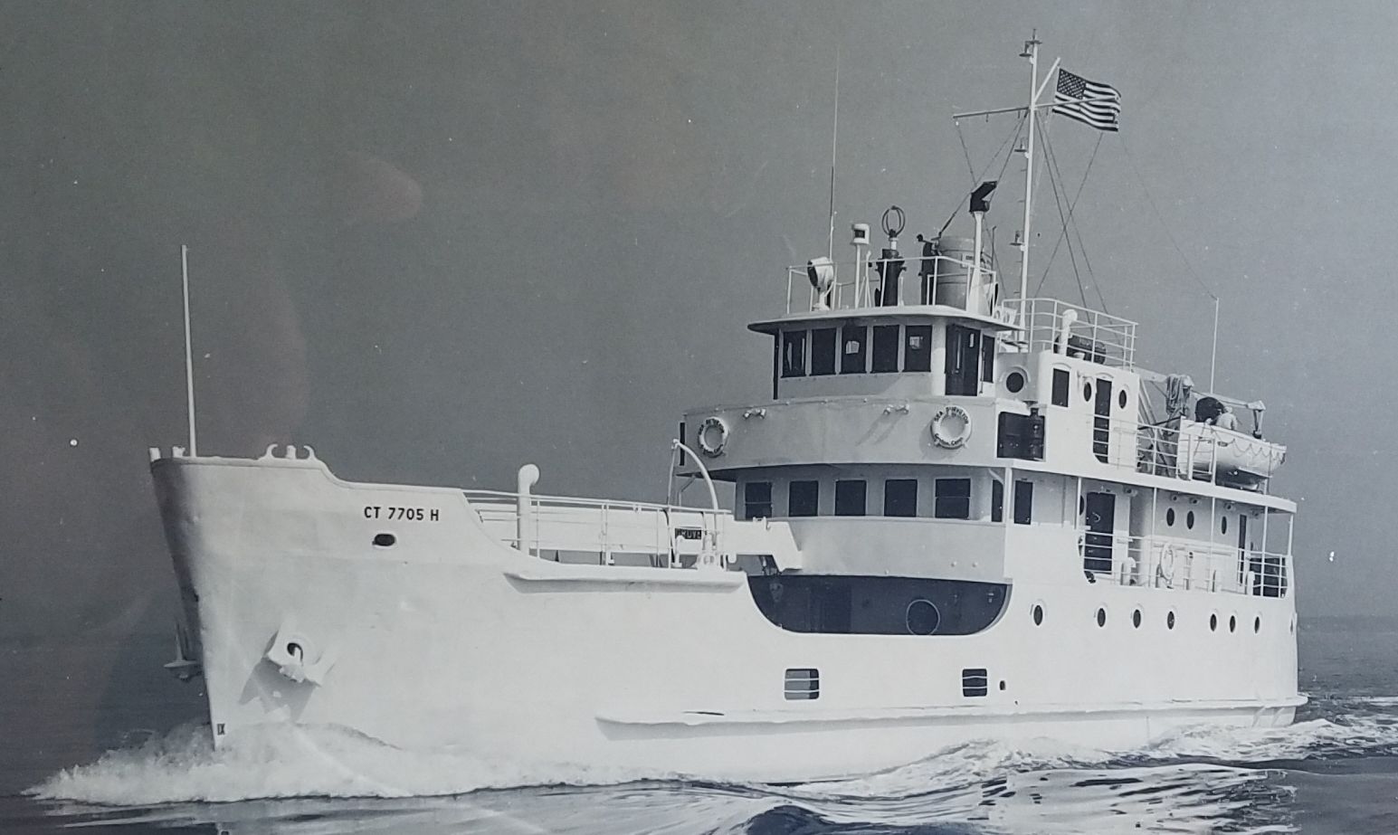 R/V Sea Surveyor, Black and White image of a water vessel. The vessel has ct7705 h on the hull. 