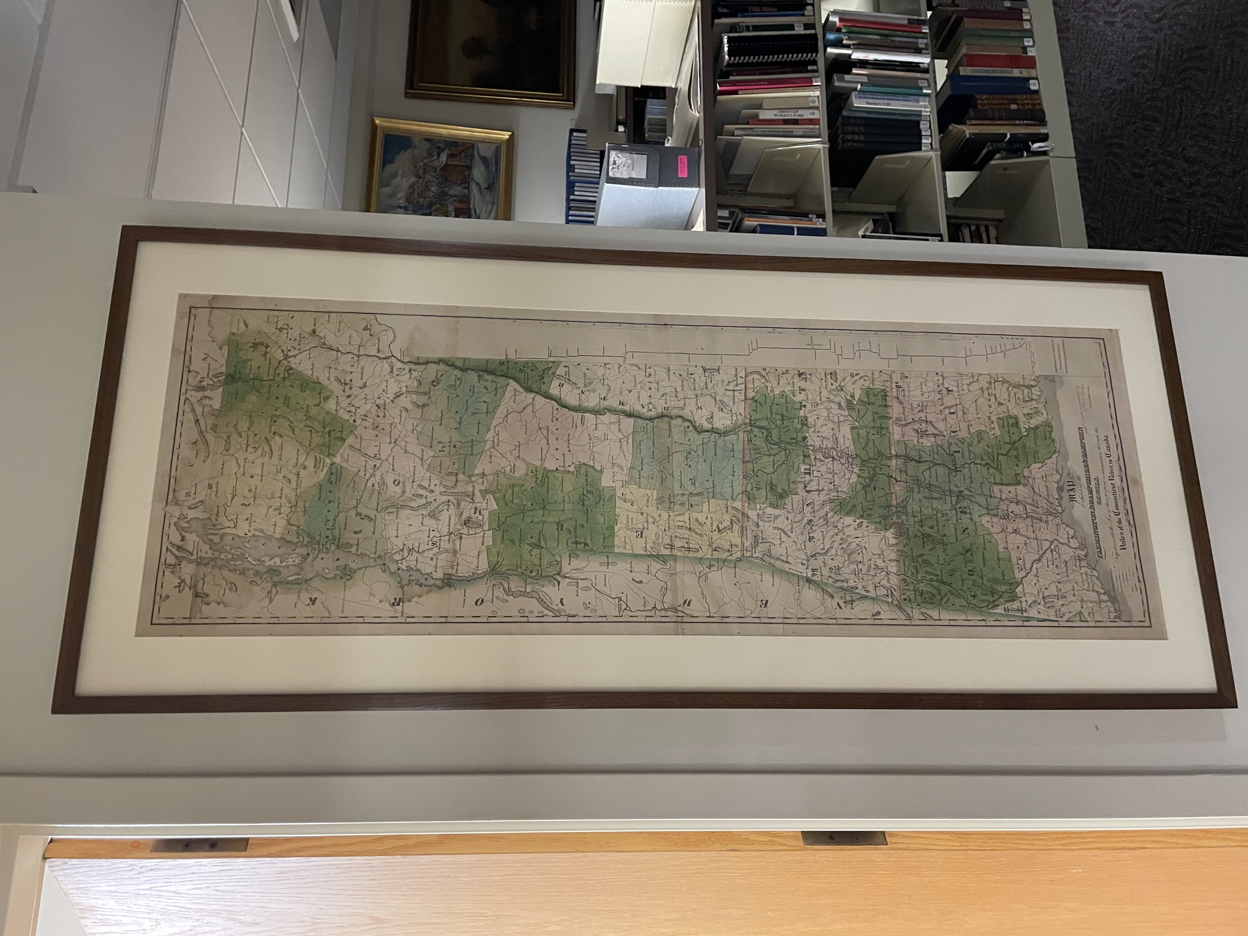 : A historic, full-color map depicting the states of Connecticut, Massachusetts, and Vermont in 1828, with indications of current and proposed canal lines. The map features town names and borders, bodies of water, and some mountainous terrain.