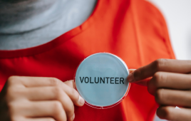 Teen Volunteer orange shirt round volunteer button