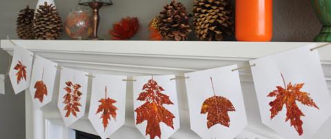 white banner on mantle with fall leaf prints