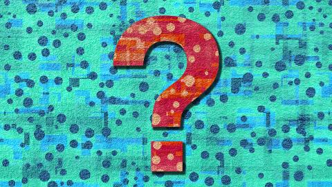 A Red Question Stylized Question Mark on a Blue polka dot background