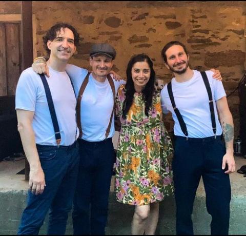 The group Mama-Train. Jazz Music Band, Four people against a brick wall background