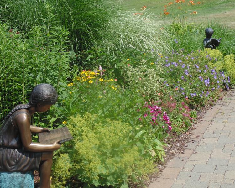 Girl and boy statue in garden